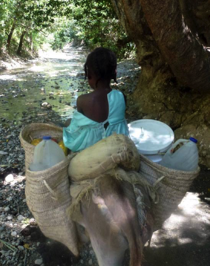 girl carrying water