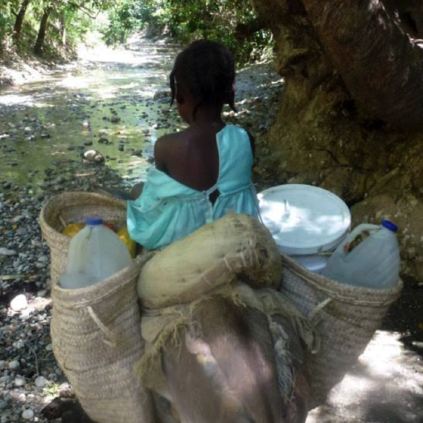 girl carrying water